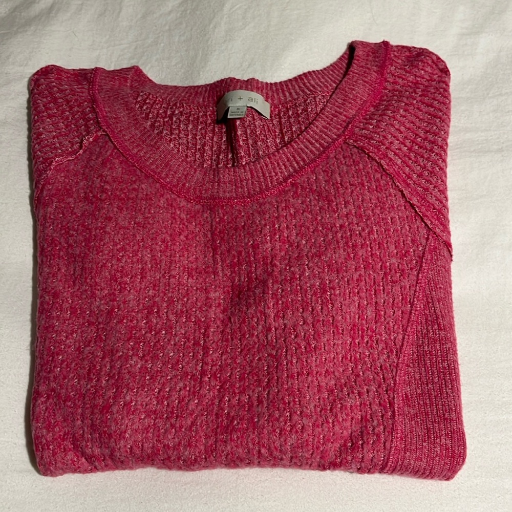 Slim pink sweater, soft fluffy fabric, tunic length.